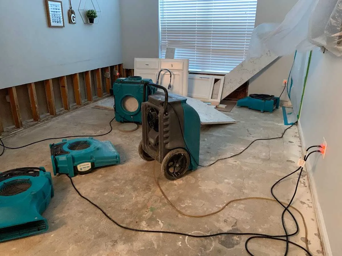 Dehumidifier in flood-cut room for Water Damage Restoration in Manistee